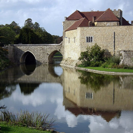 leeds castle and moat with a bridge to the gatehouse