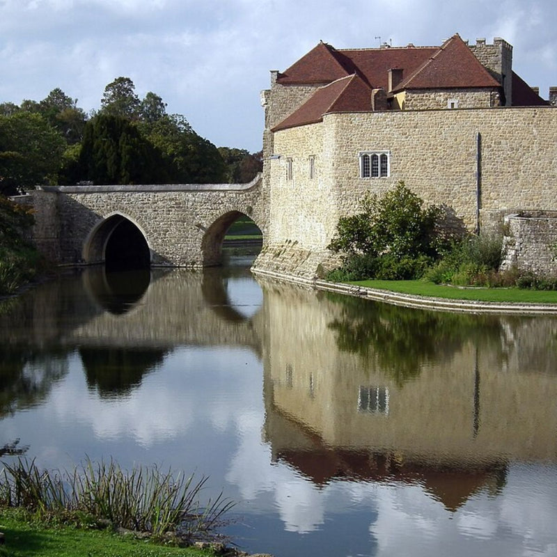 leeds castle and moat with a bridge to the gatehouse