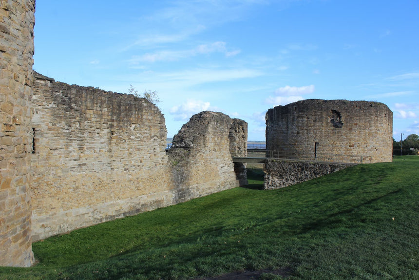 The great tower of Flint Castle, its moat and the curtain wall, October 2026