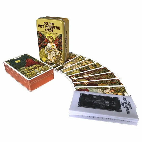 Golden Art Nouveau Tarot cards with a deck, box, and book on a white background