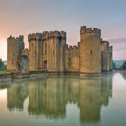 Bodiam Castle with moat reflection during sunset