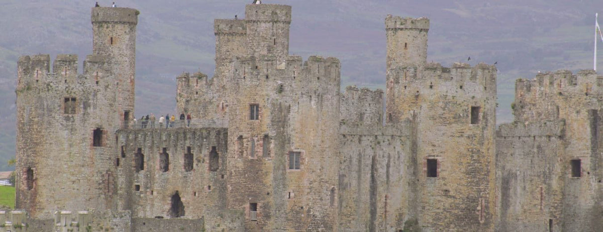 Conwy castle set against a grey sky overaid with the words Discover the Past. Explore the Magic above the website title Histories and Castle, substitle The hidden history of Medieval Britain. Not the version they wanted you to read. Underneath, two buttons to The Academy and Investigated Histories.
