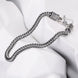 Silver braided necklace on a white mannequin
