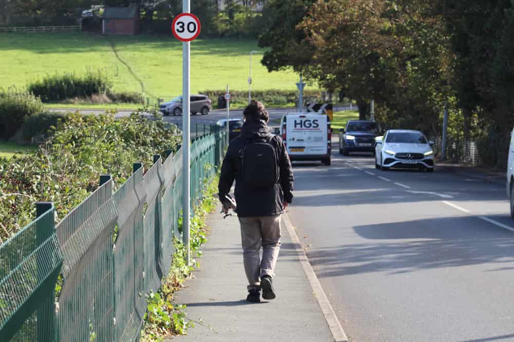 Simon A. Williams walking over the railway bridge next to Prestatyn Castle