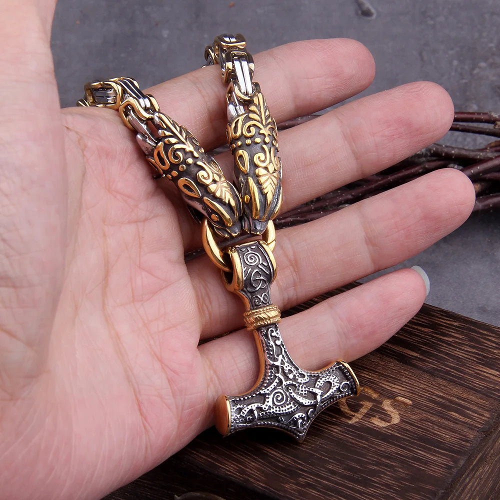 Decorative bracelet with intricate designs on a hand against a wooden surface