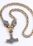 Stainless steel Mjolnir pendant with wolf head clasp on gold and silver byzantine chain on a white background