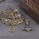 Viking-themed necklace with chain and pendant on a textured surface
