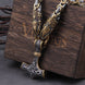 Decorative necklace with intricate design on a wooden block
