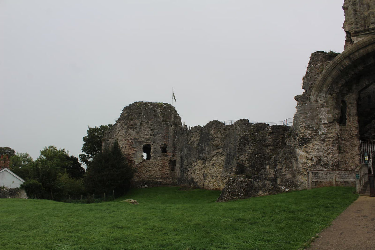 Curtain walls and towers around the inner ward of Denbigh Castle, with the great gatehouse at the edge of the picture, October 2026