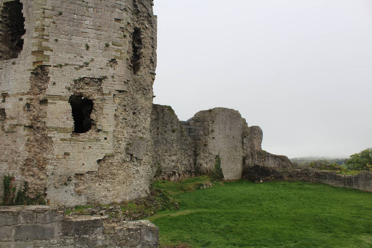 Ruined stone tower and curtain wall of Denbigh Castle beside the inner ward, October 2026