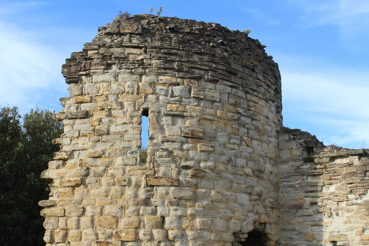 An arrow slit in one of the corner towers of Flint Castle, October 2026