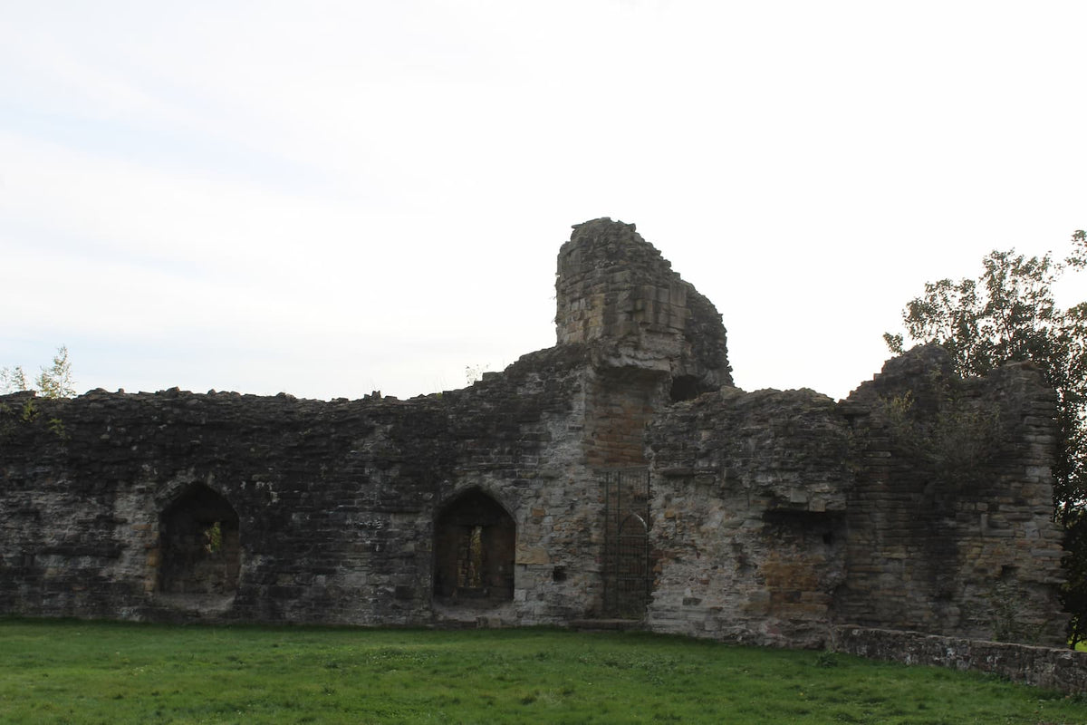 Arched recesses in the inner face of the curtain wall at Flint Castle, October 2026