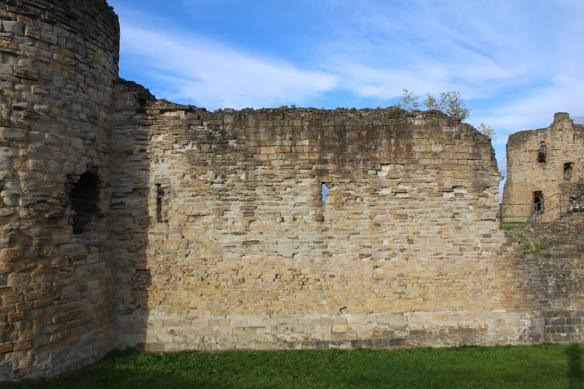 The curtain wall running to the north-east tower of Flint Castle, October 2026