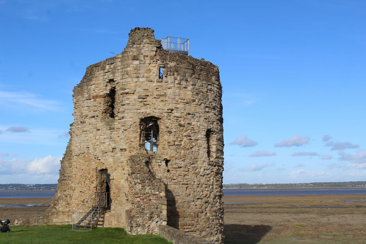 The north-east tower of Flint Castle and the steps to its doorway, with the Dee Estuary beyond, October 2026