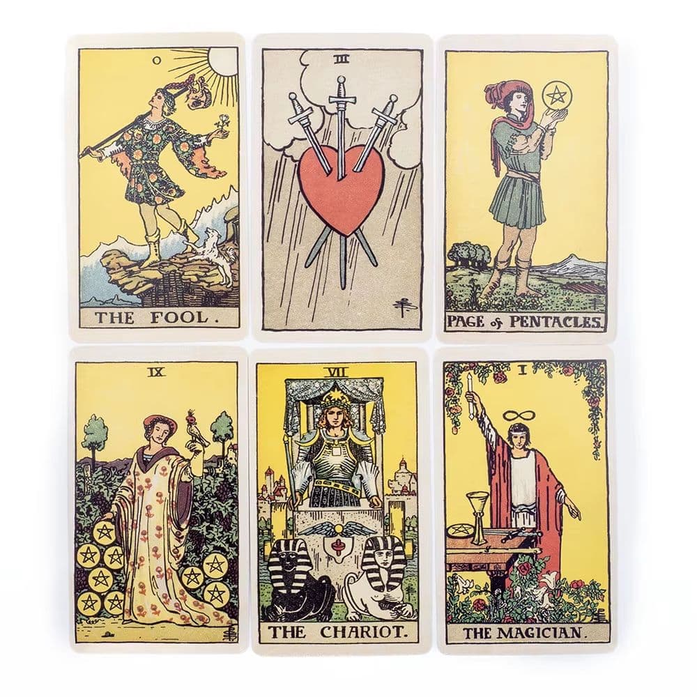 Six classic Rider-Waite fortune telling cards tarot cards arranged in a 2x3 grid on a white background, featuring The Fool, Page of Pentacles, The Hanged Man, The Chariot, The Magician, and The Devil.