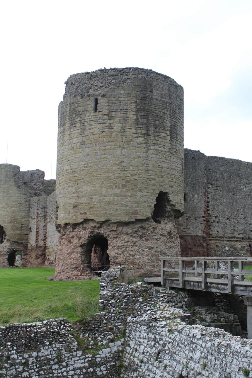 Round tower of Rhuddlan Castle with the footbridge over the moat, October 2026