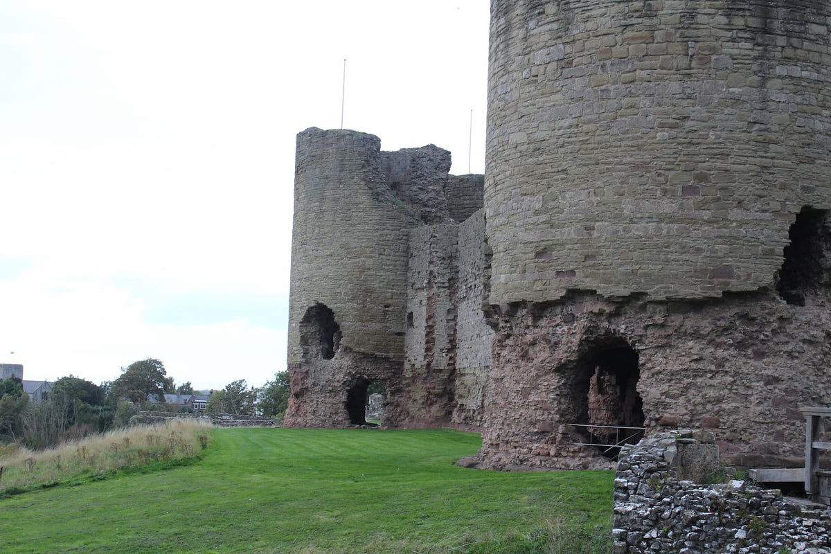 Base of a round tower at Rhuddlan Castle with the gatehouse behind