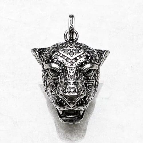 The Black Panther Pendant features a detailed panther head with intricate patterns and a textured surface, showcased against a plain white background.