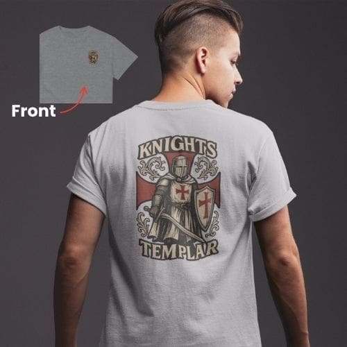 A person wears the Defender of the Faith – Knights Templar Edition T-shirt: gray with a bold knight and red cross shield on the back, KNIGHTS TEMPLAR text, and a small Defender of the Faith crest on the front left.