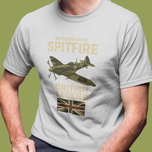 A person wears a light gray Submarine Spitfire T-Shirt with an illustration of a Spitfire airplane, “Supermarine Spitfire” and “British Legend” text, plus a British flag beneath the text.