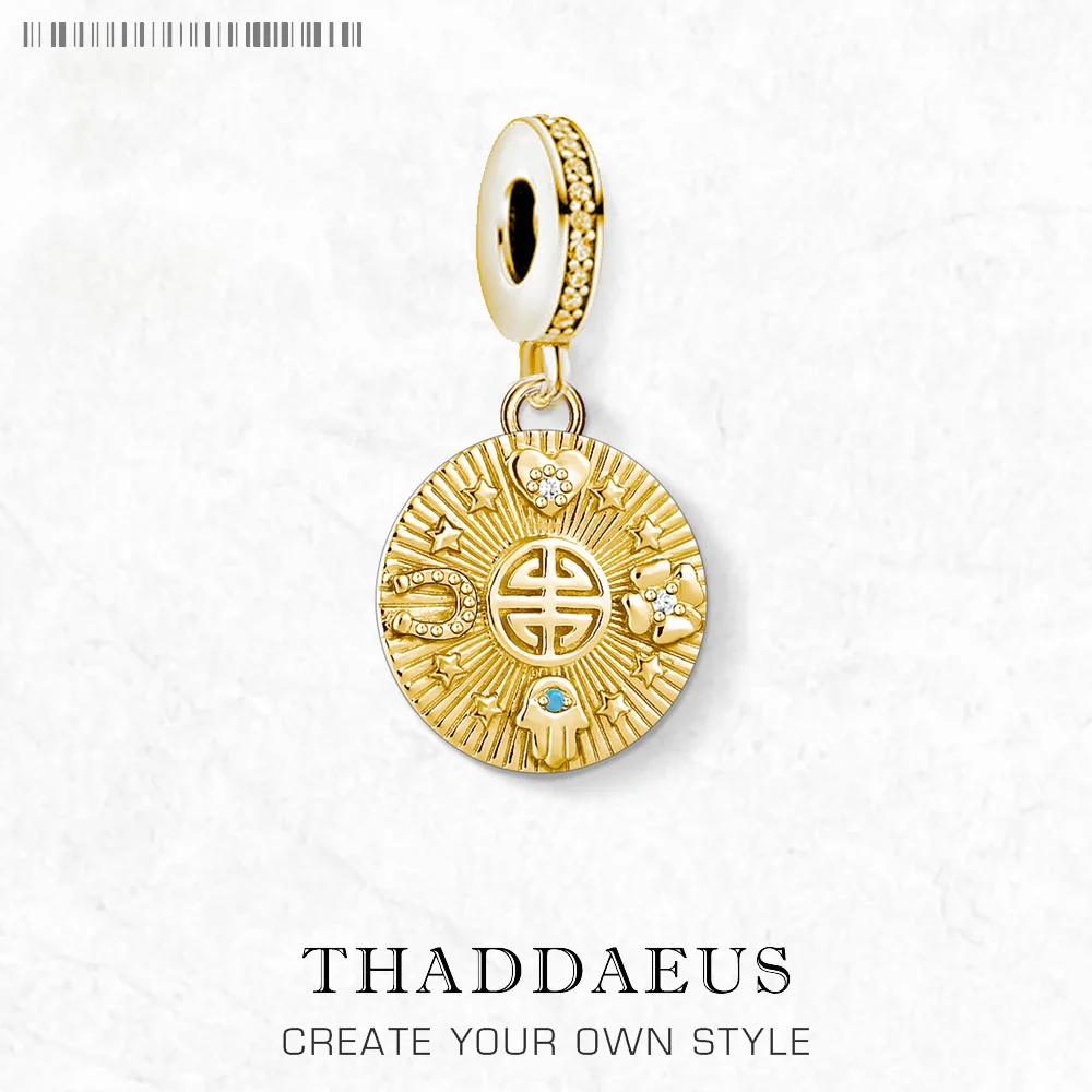 The Golden Lucky Coin Charm for Women, made of 925 sterling silver with a vintage pendant design, features engraved patterns, a central symbol, gemstones, and a lobster clasp.