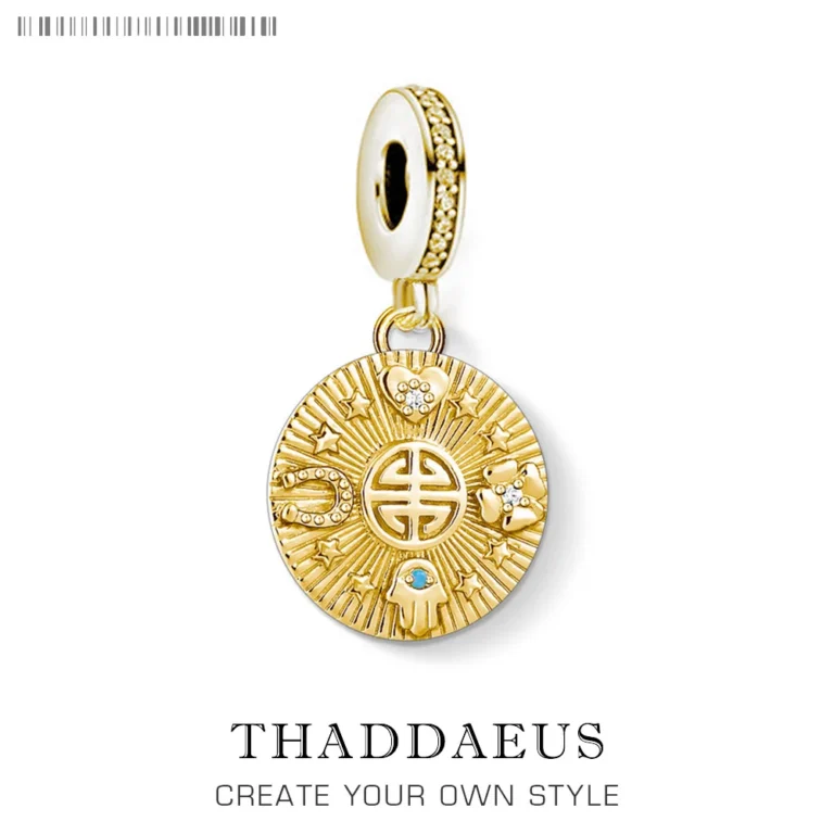 The Golden Lucky Coin Charm for Women, made of 925 sterling silver with a vintage pendant design, features engraved patterns, a central symbol, gemstones, and a lobster clasp.