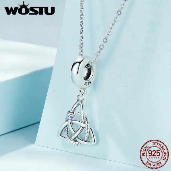 Close-up of the Celtic Knot Snake Pendant—an intricately detailed silver amulet featuring a coiled serpent intertwined with an endless knot, symbolising protection, rebirth, and ancient Celtic wisdom.